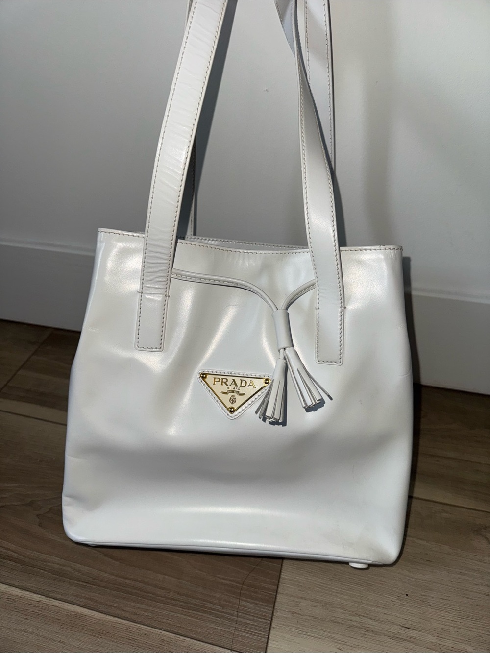 Prada 1990’s White Leather Tote with Tassel Accent and Gold Logo